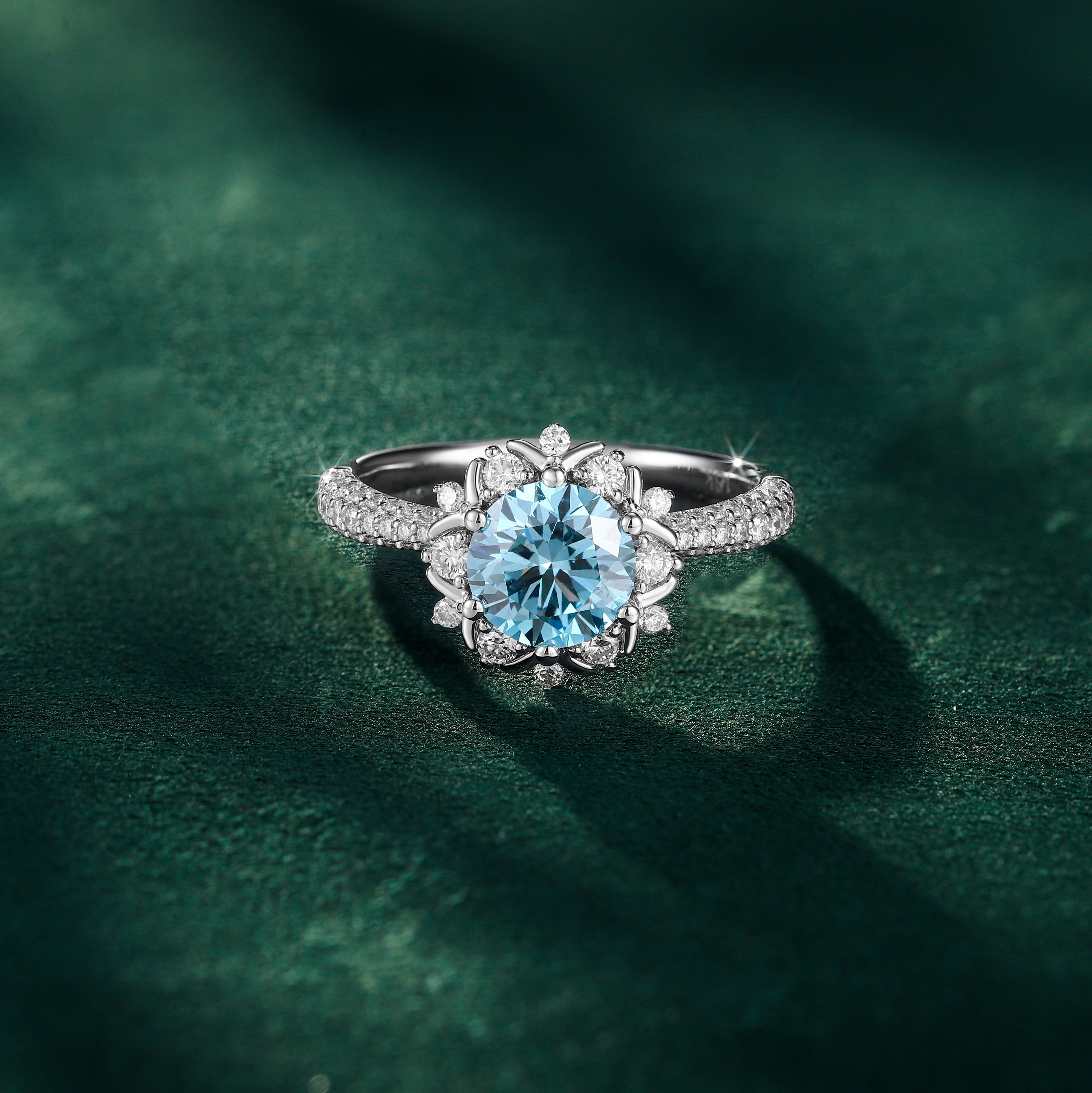 Lab grown blue diamond halo engagement ring in white gold by Sommarnox