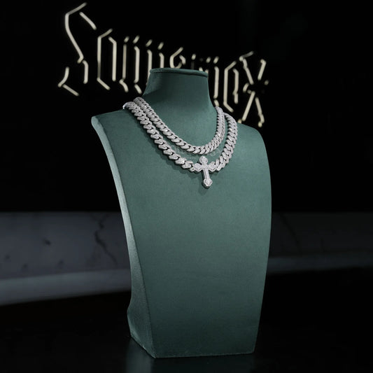 Sommarnox Cuban and cross two-chain set on a green display bust