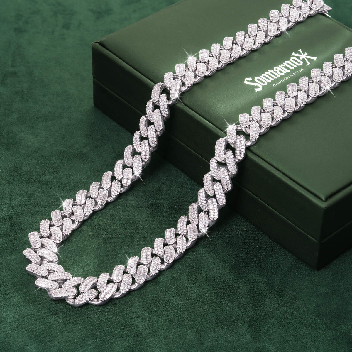 Sommarnox iced out Cuban link chain necklace displayed on a green jewelry box
